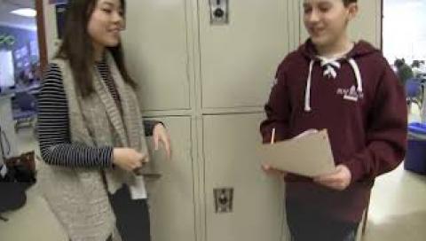 two kids talking by lockers